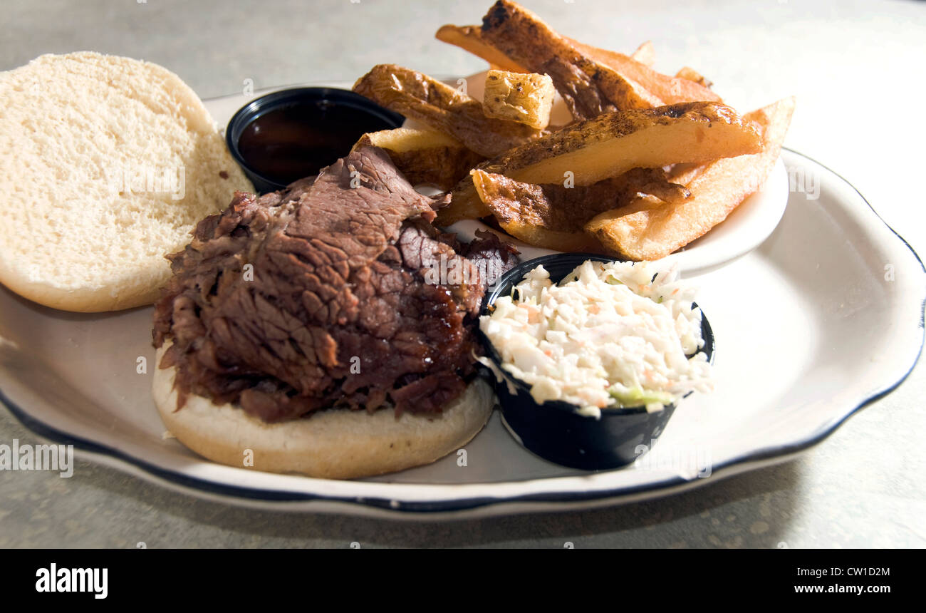 brisket beef sandwich with cole slaw steak fries barbecue sauce at