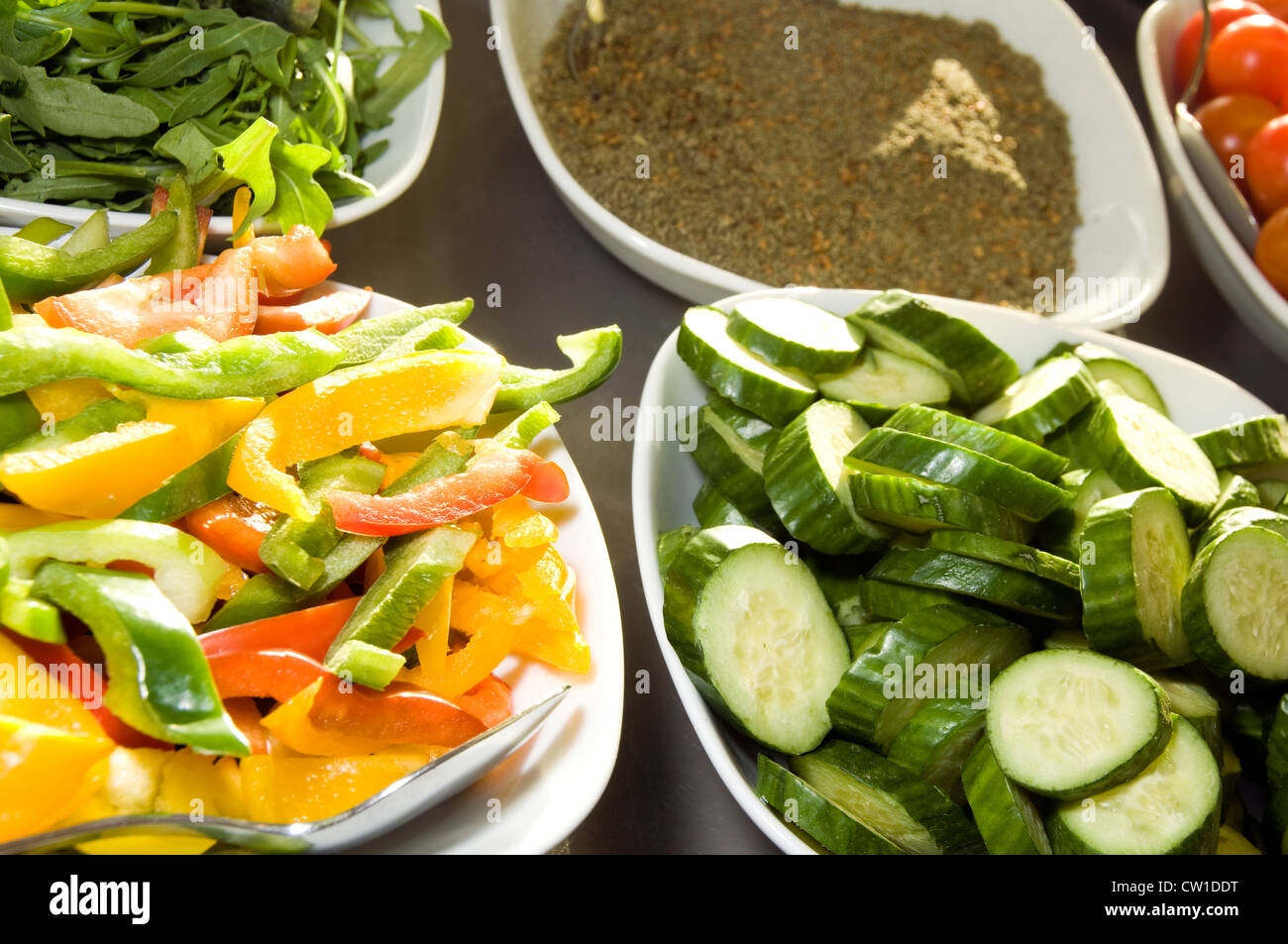 sliced vegetables zucchini peppers tomatoes with spice breakfast hotel buffet phototgraphed in Jerusalem Palestine Israel Stock Photo