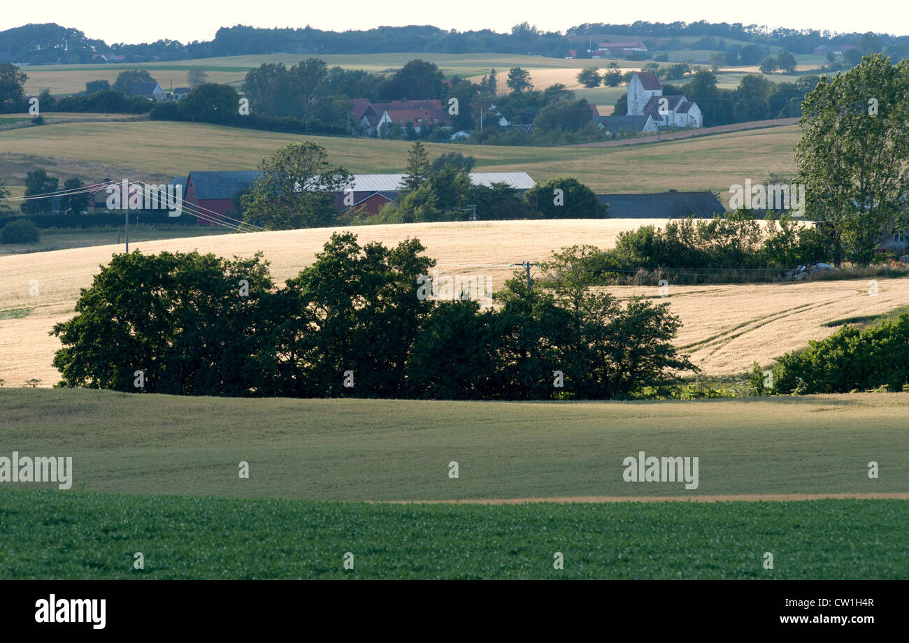 Hilly farming landscape with farms and an old church Stock Photo