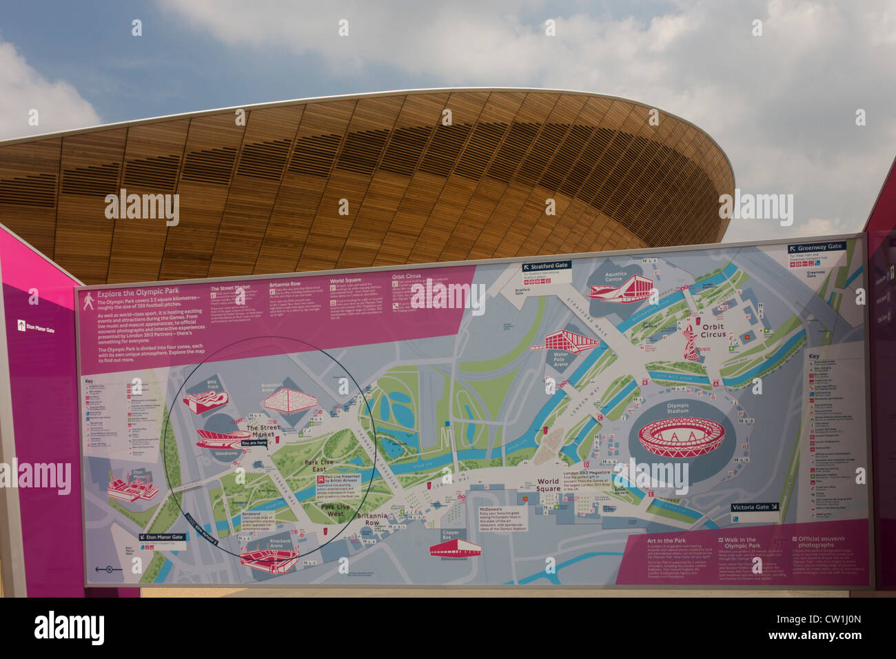 A map and exterior of the £105m Siberian Pine Velodrome curved roof during the London 2012 Olympics. The London Velopark is a cycling centre in Leyton in east London. It is one of the permanent Olympic and Paralympic venues for the 2012 Games. The Velopark is at the northern end of Olympic Park. It has a velodrome and BMX racing track, which will be used for the Games, as well as a one-mile (1.6 km) road course and a mountain bike track. The park replaces the Eastway Cycle Circuit demolished to make way for it.(More captions in Description..) Stock Photo