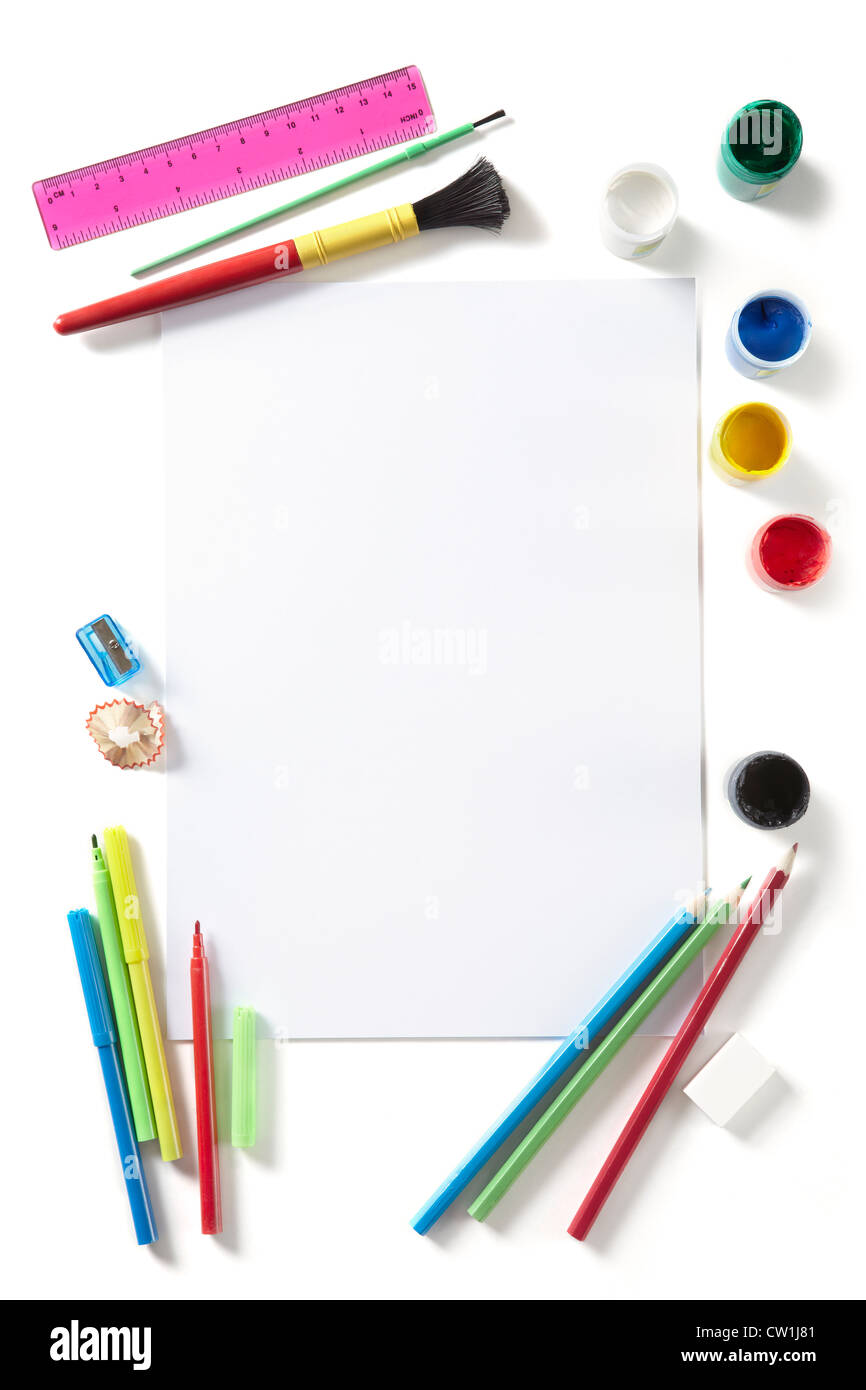 Back to School pupils art pad paints pencils and pens on white school desk from above Stock Photo