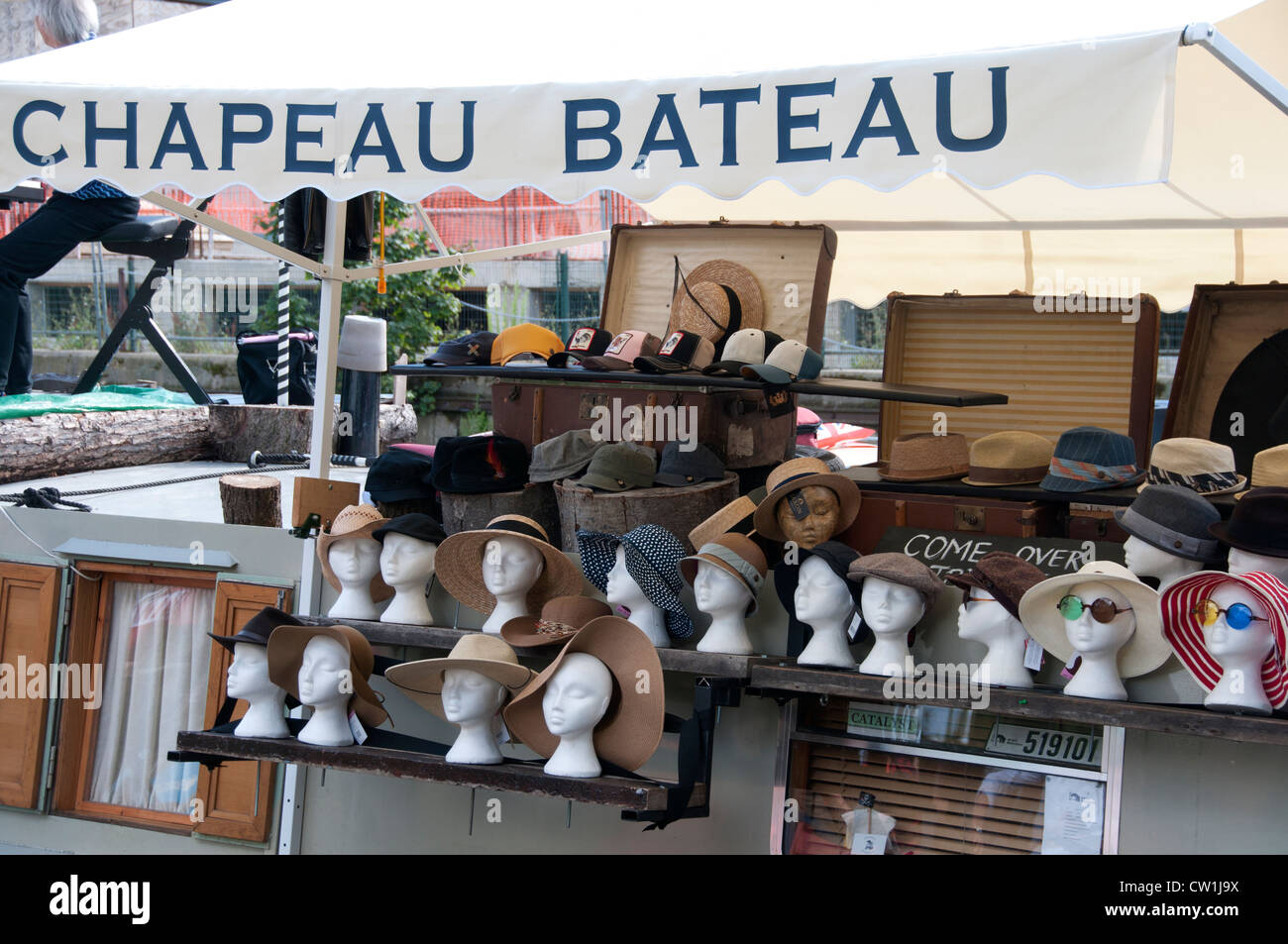 London Mile End Park floating market on the Regent's canal - Chapeau Bateau selling hats from a barge Stock Photo