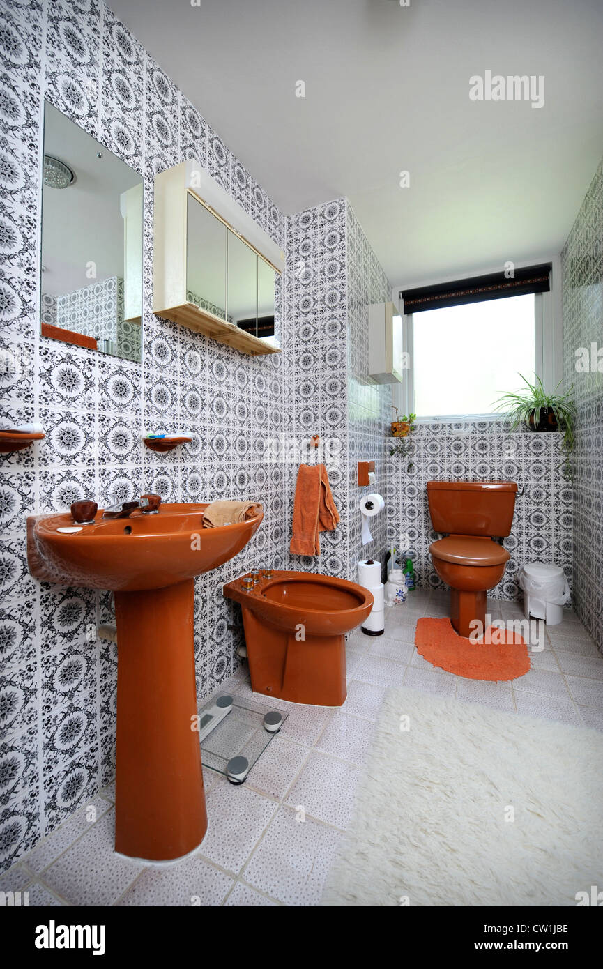 Bathroom with brown suite in a 1970's style house which was featured in a 1975 magazine makeover UK Stock Photo
