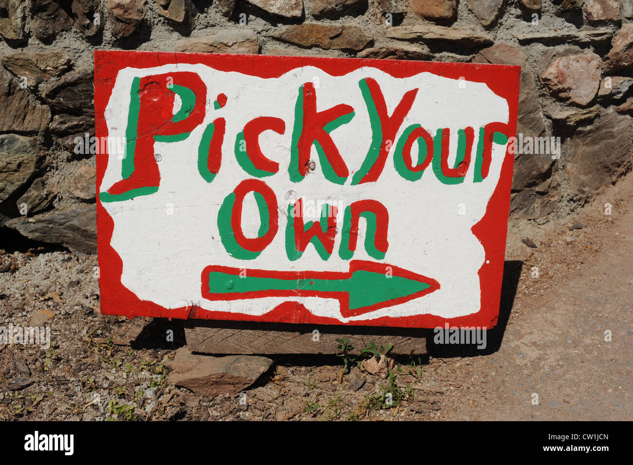 A hand-painted sign for a Pick Your Own farm in Ashprington, Devon Stock Photo