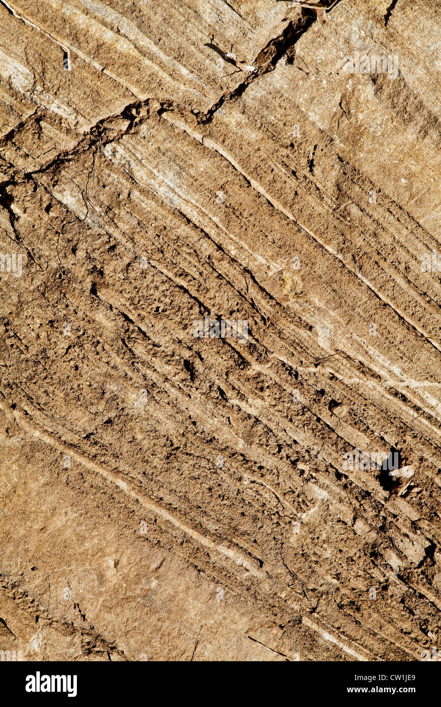 mountainside rock texture with marbling streaks embedded through evolution Stock Photo