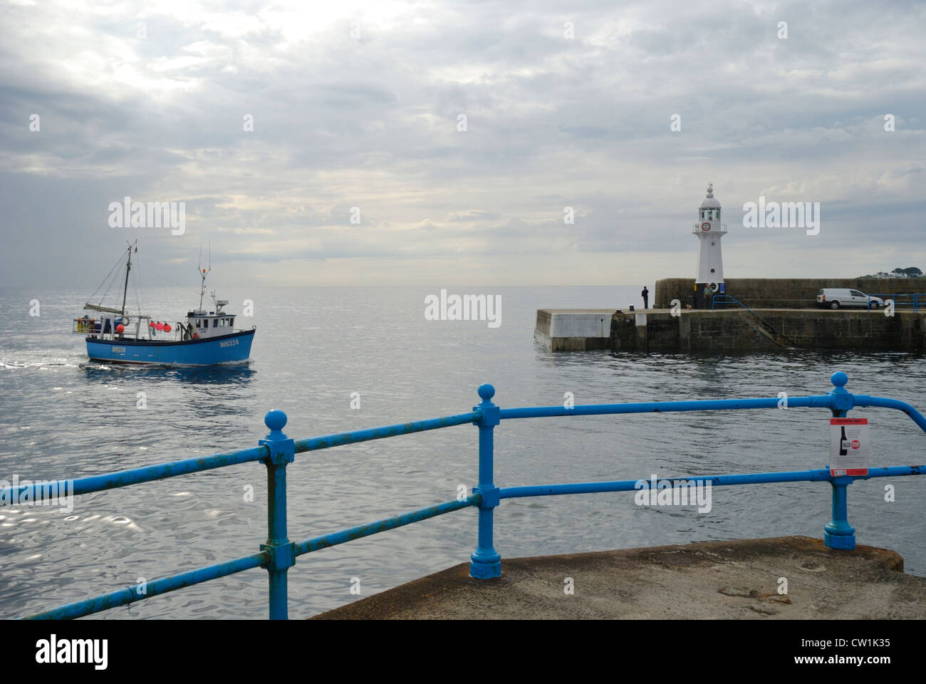 Fishing boat entering the harbour at Mevagissey, Cornwall, England Stock Photo