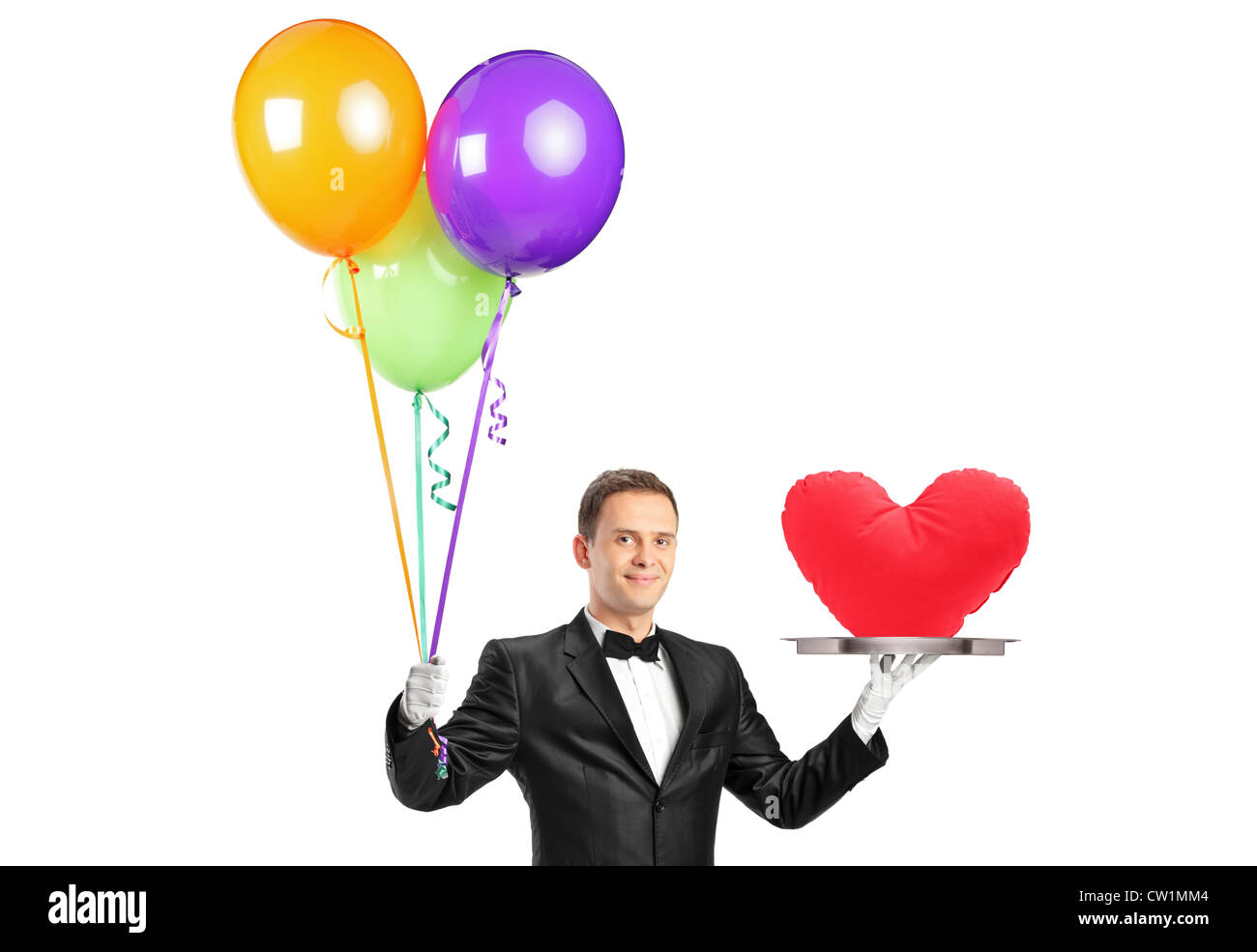 A butler holding balloons and a tray with a heart shape object isolated ...