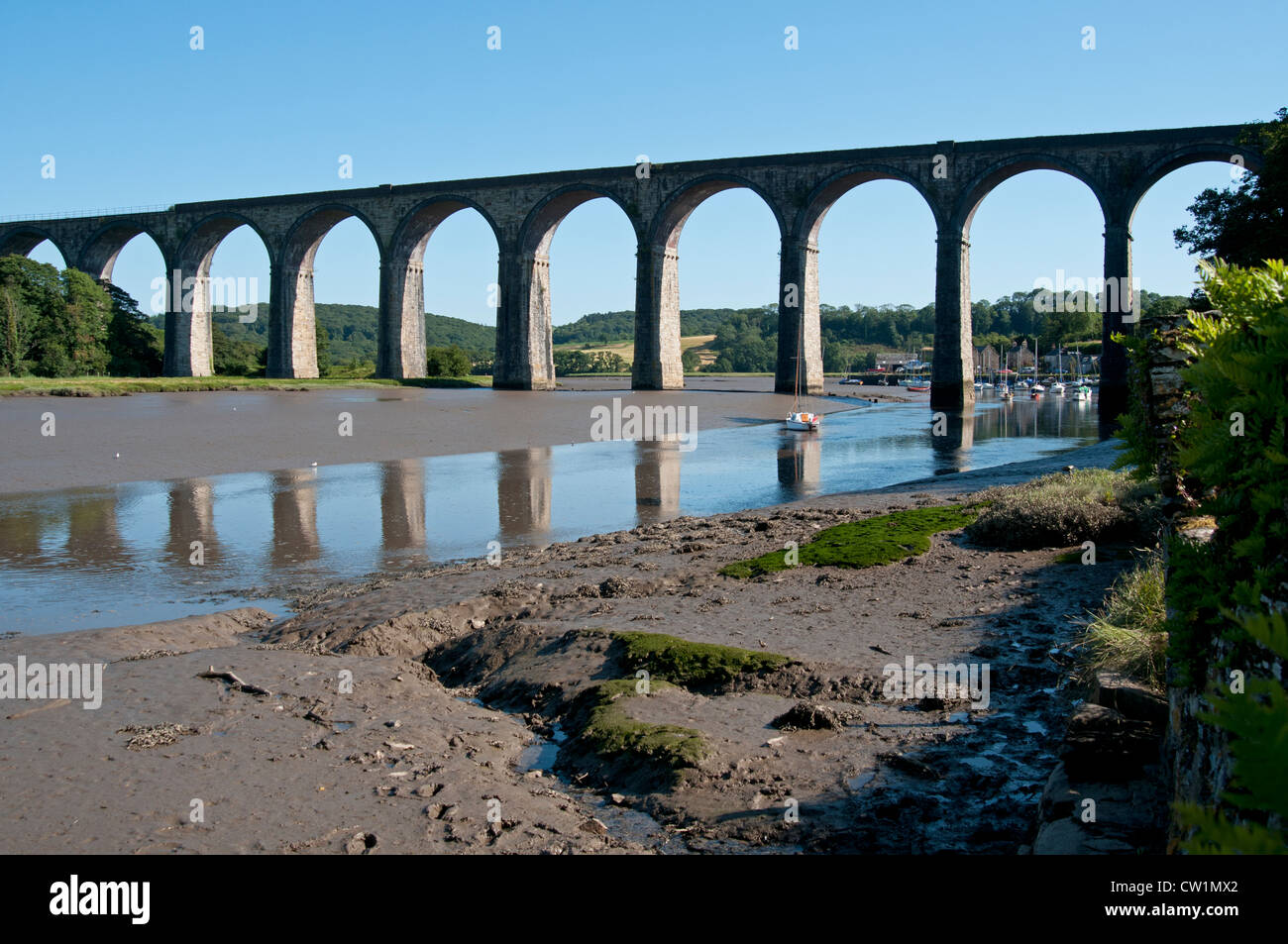 The Viaduct & muddy estuary with the tide out at Port Eliot St Germans Cornwall UK Stock Photo