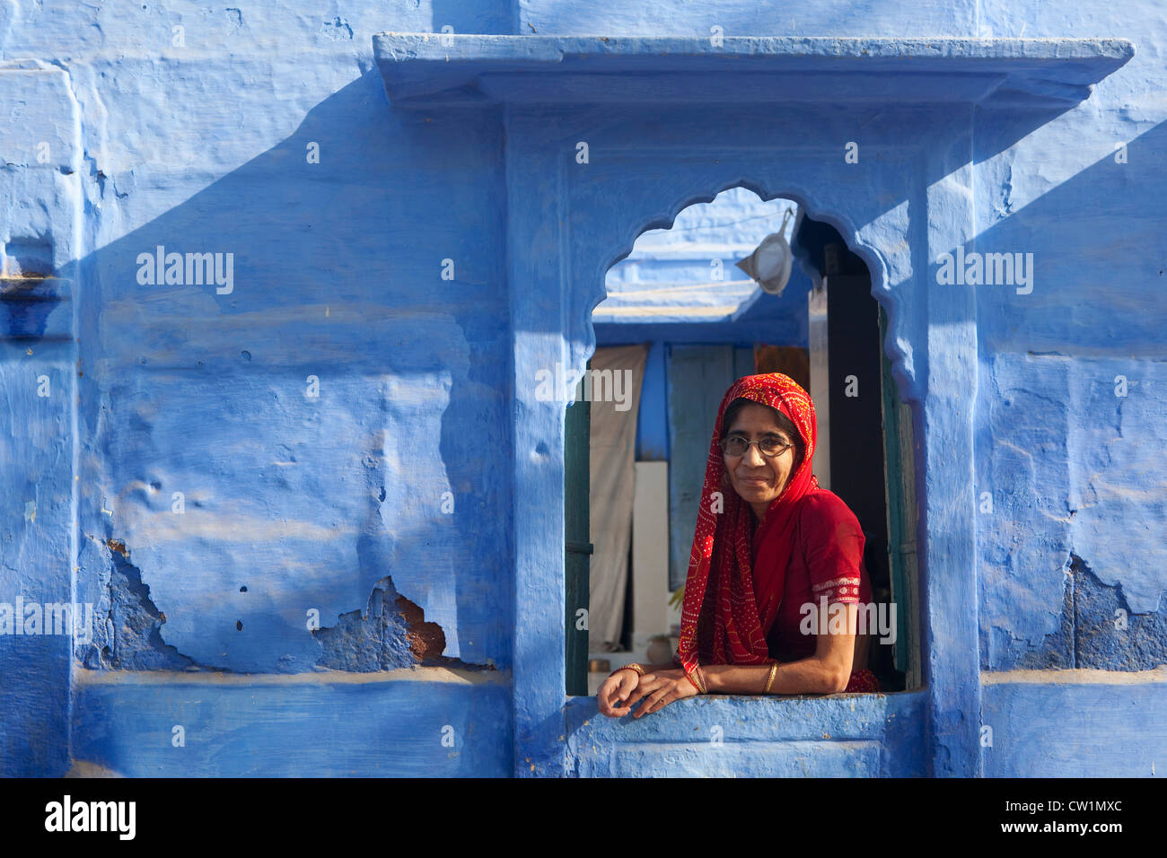 Portrait of Indian lady at window, Rajasthan, India Stock Photo