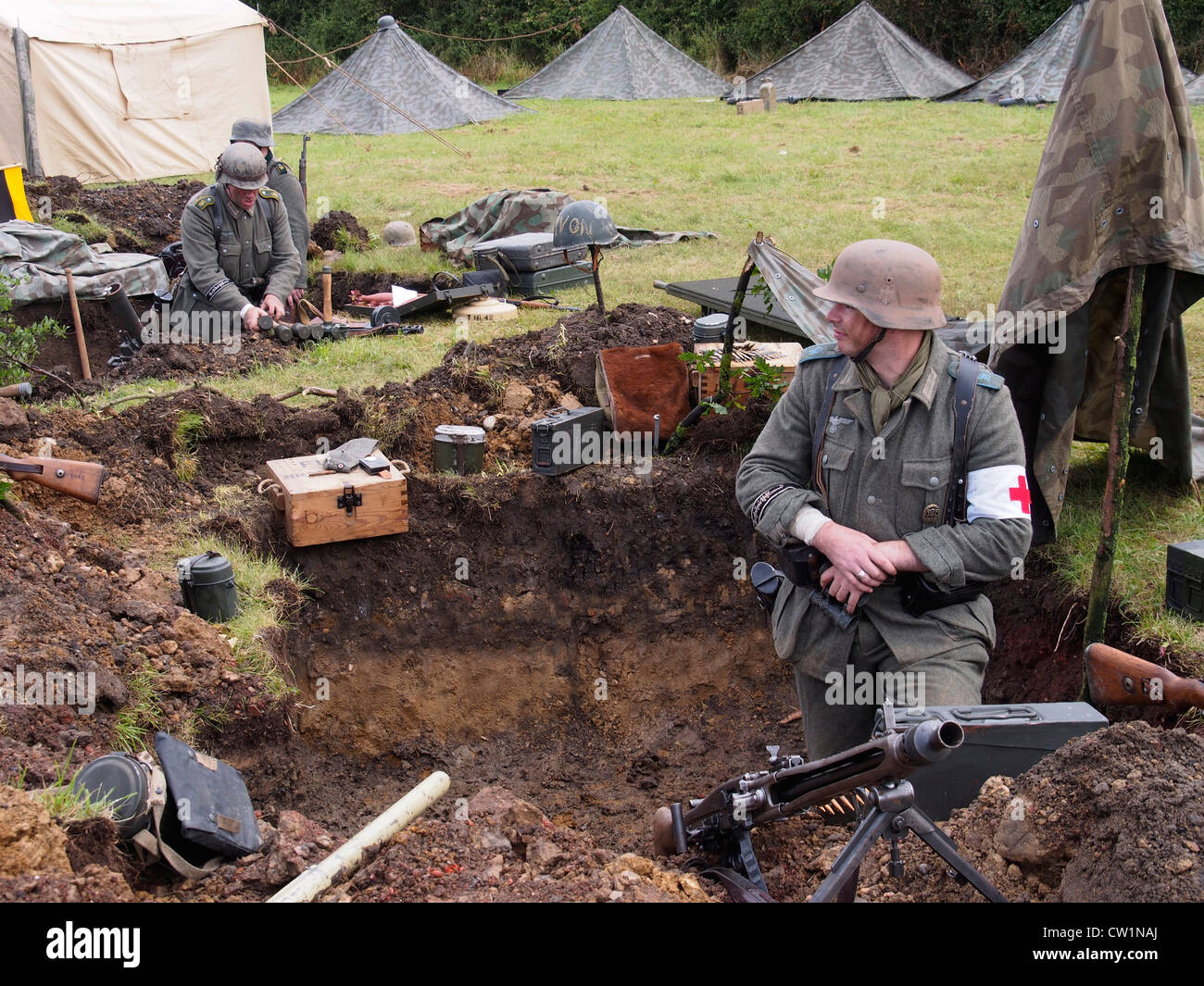 Two German soldiers in the trenches at machine gun post at Essex & London's premier military vehicle show. Stock Photo