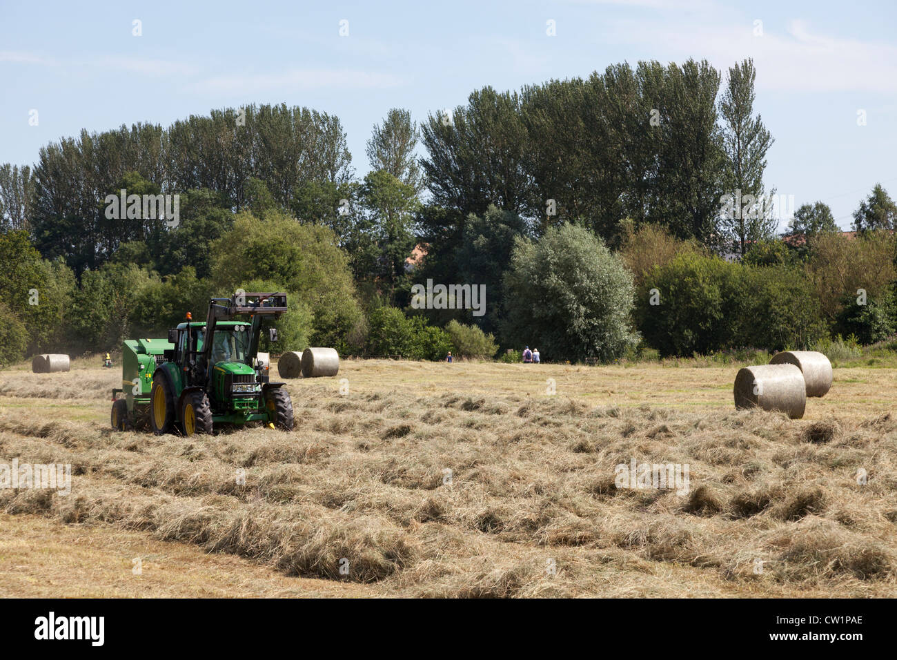 Tractor baling hay, Castle Meadows, Abergavenny, Wales, UK Stock Photo