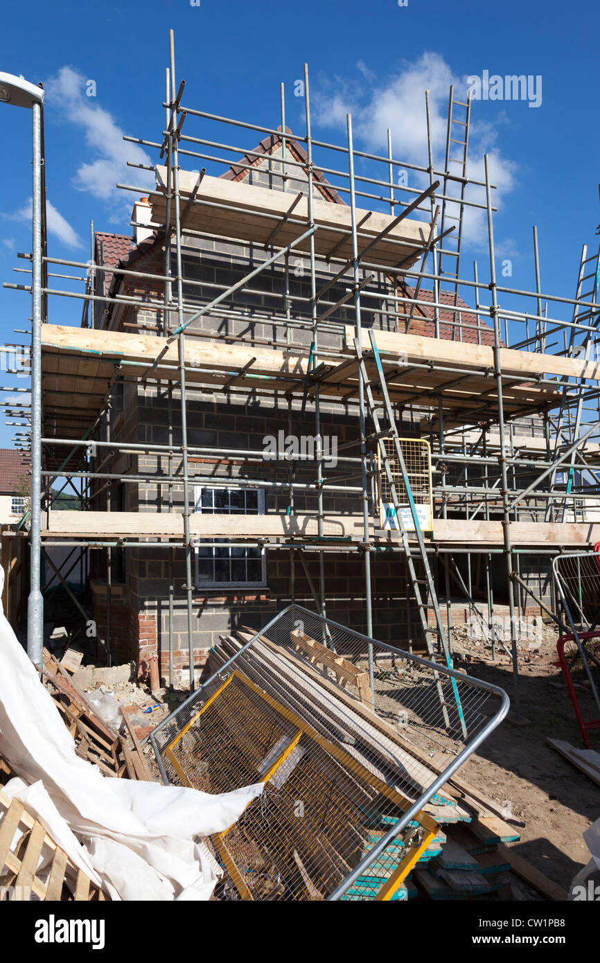 New build house on new estate under construction with scaffolding, Abergavenny, Wales, UK Stock Photo