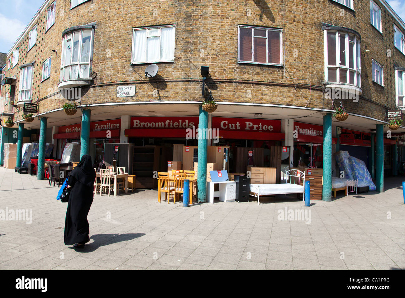Muslim woman walking in Chrisp Street Market, Poplar, Tower Hamlets, London, England, UK. Stock Photo