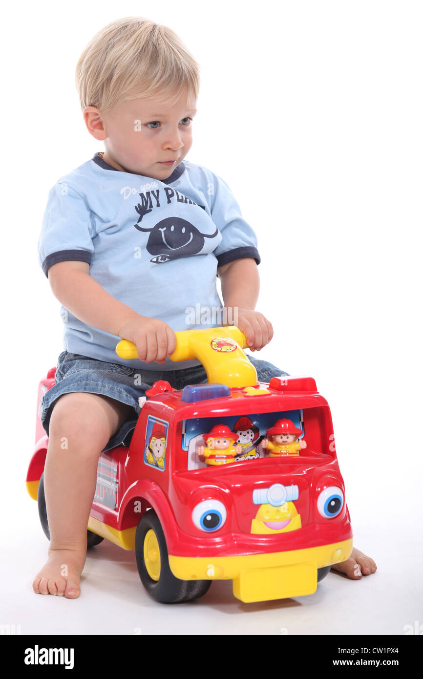 little boy playing with a toy car Stock Photo Alamy
