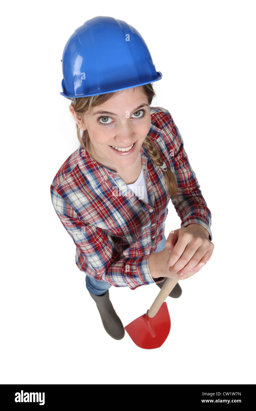 Woman holding spade Stock Photo - Alamy