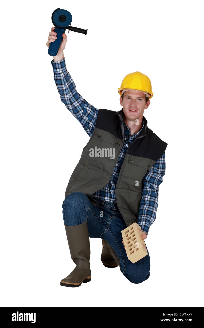 Man holding a circular saw Stock Photo - Alamy