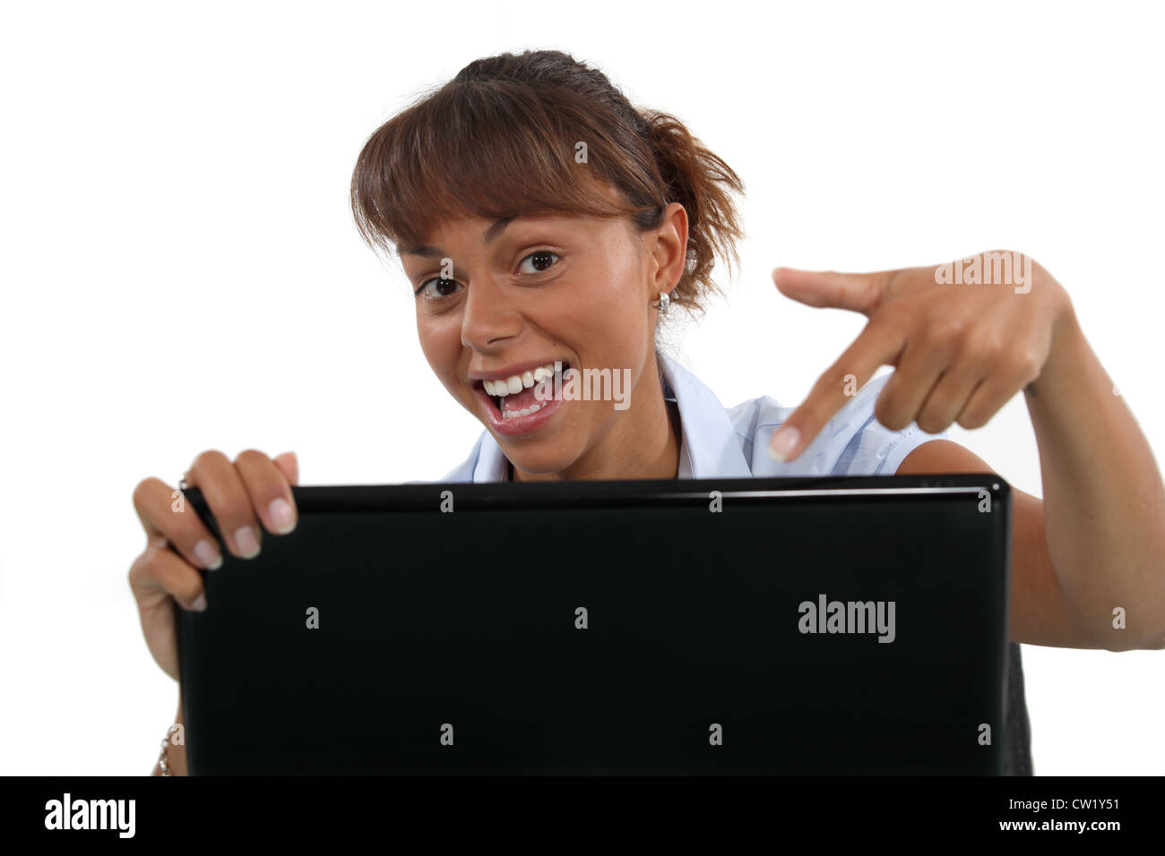 Woman pointing to her laptop Stock Photo - Alamy