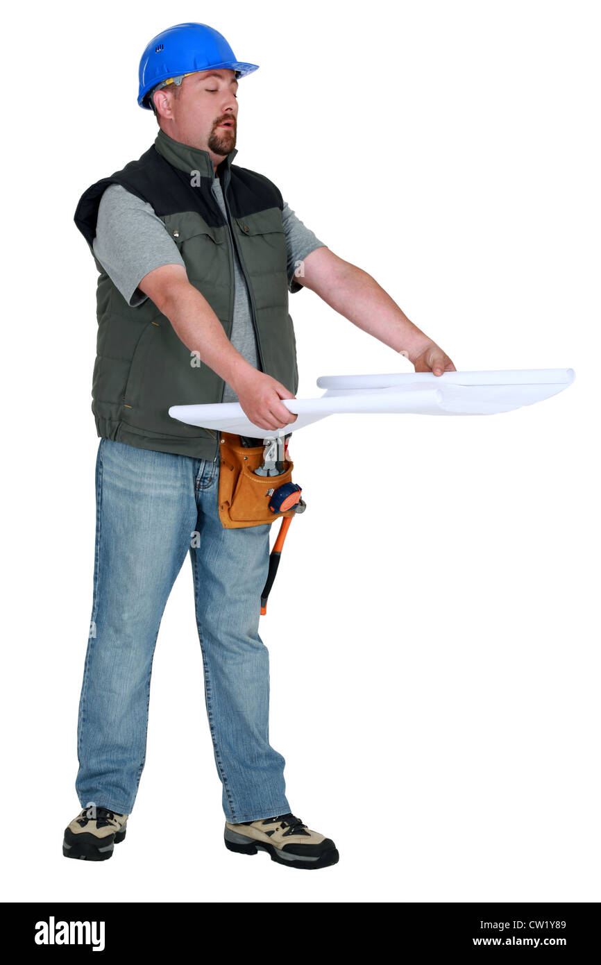 craftsman looking at a blueprint Stock Photo - Alamy