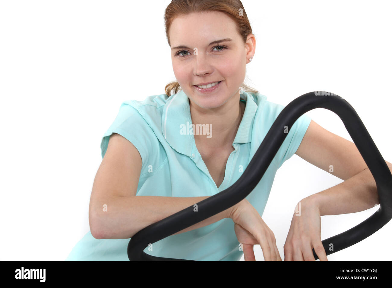 Woman on a cross trainer Stock Photo Alamy