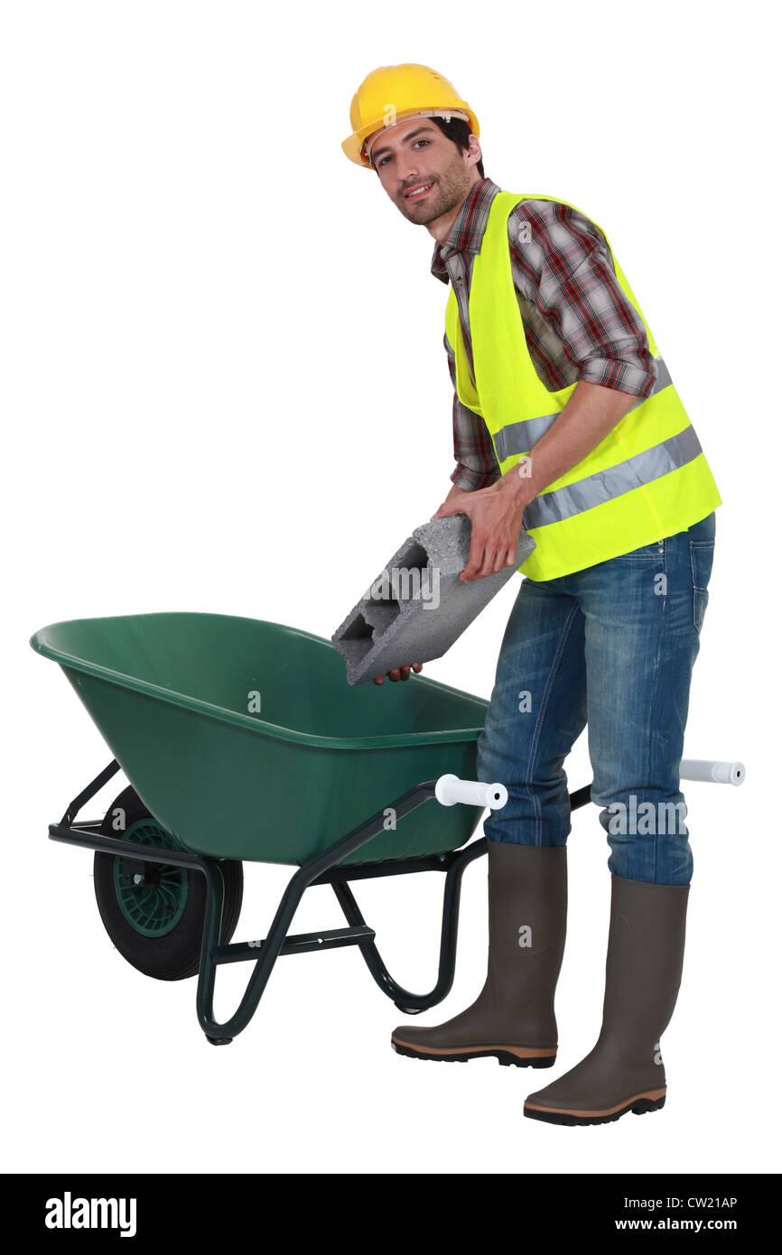 Builder with a wheelbarrow Stock Photo Alamy