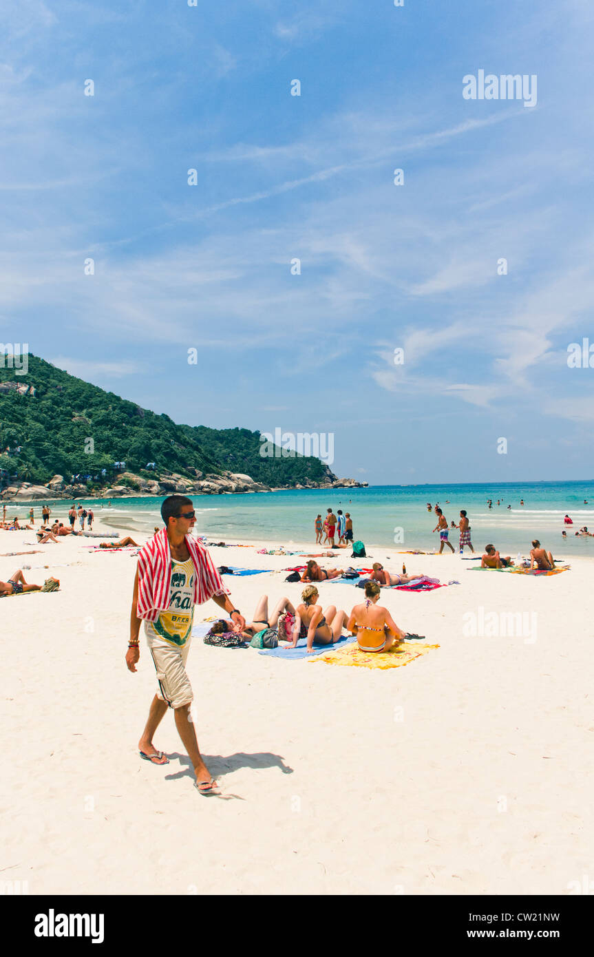 tourists at Haad rin beach of koh phangan thailand, where full moon party is held. Stock Photo