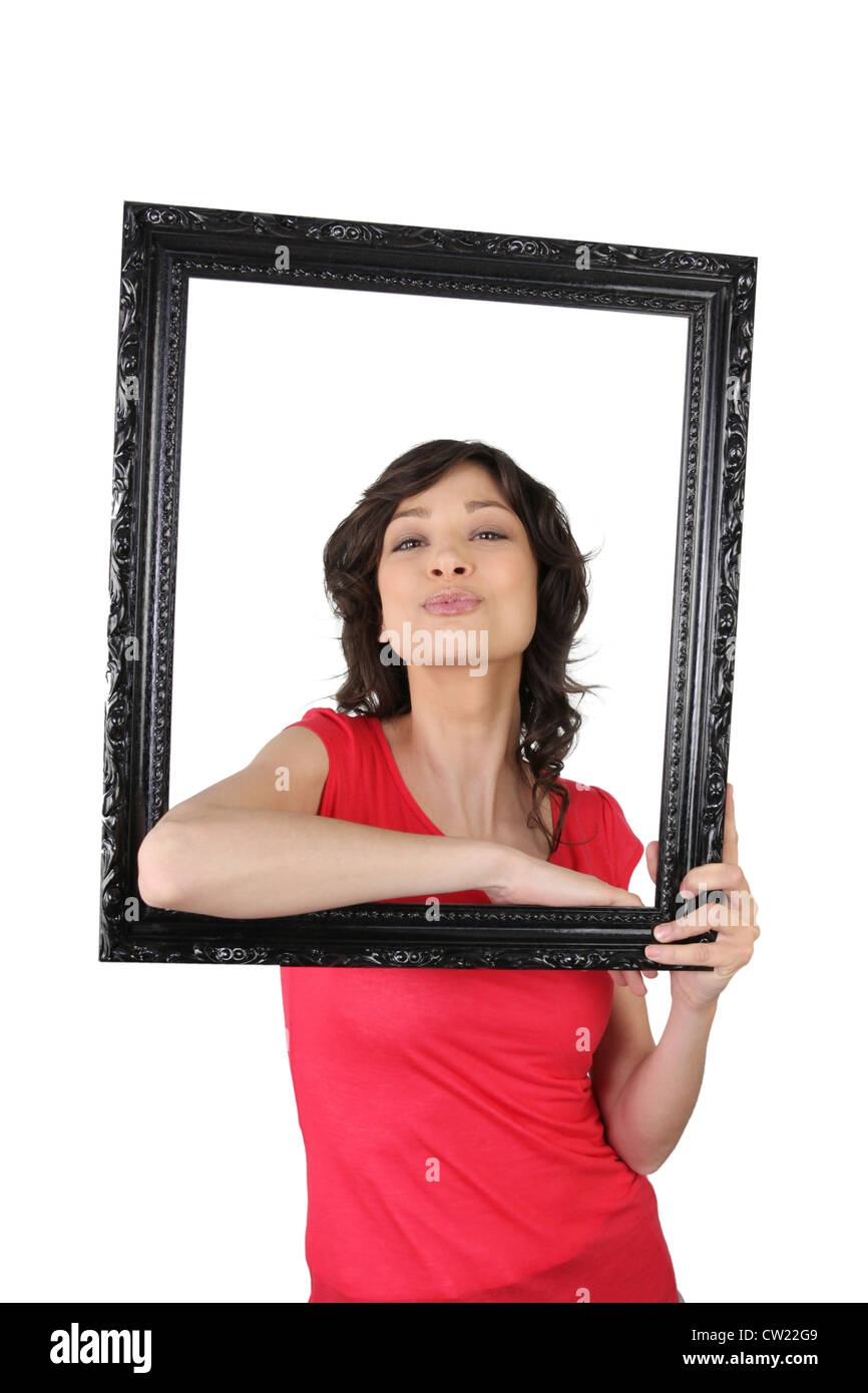 Young woman posing inside a picture frame Stock Photo - Alamy