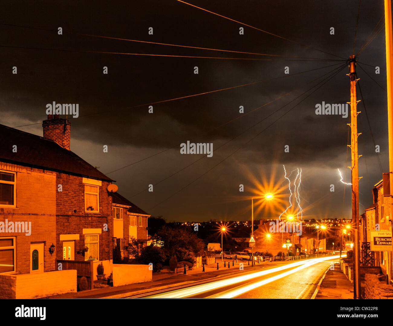 Lightning bolt strike in a night time stormy sky over Awsworth