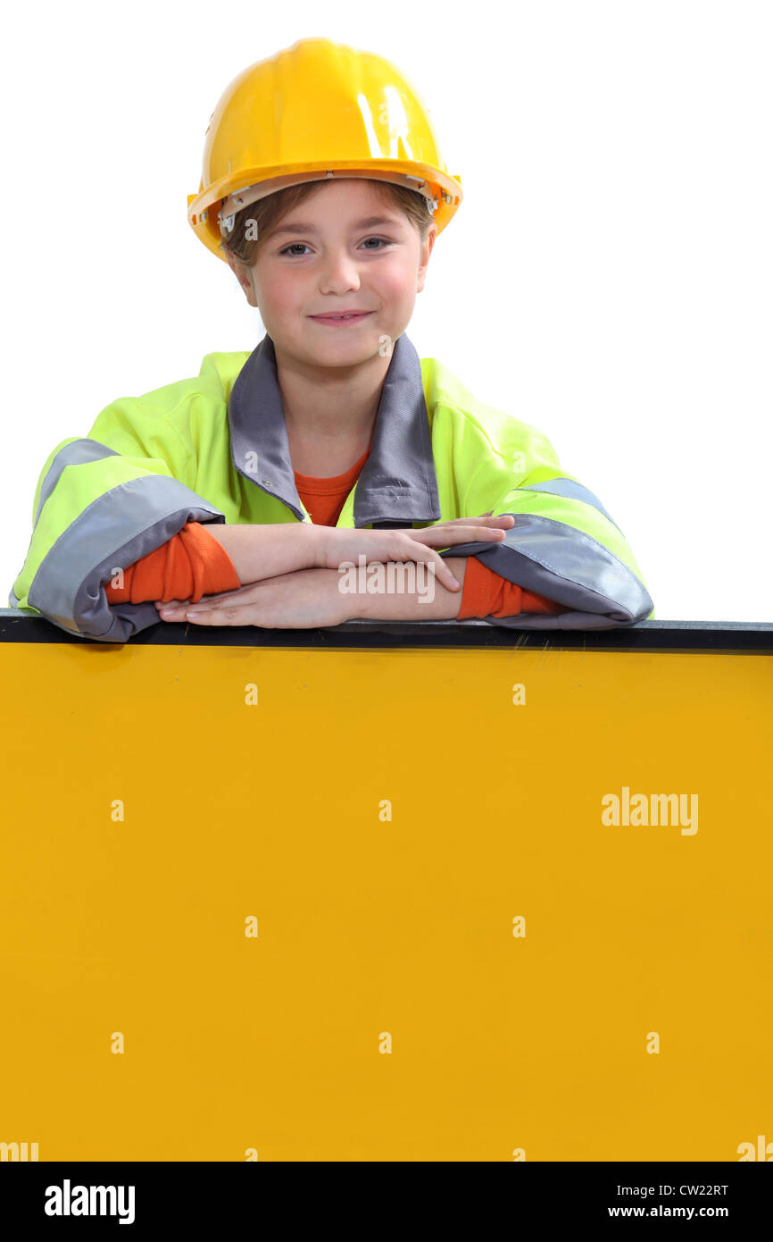 Girl with yellow helmet Stock Photo - Alamy