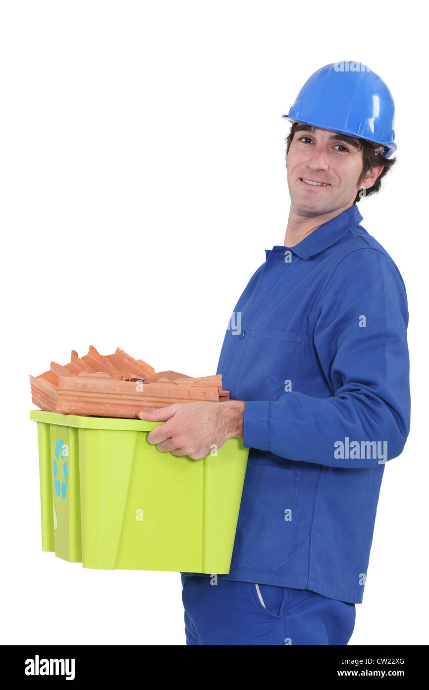 Tradesman taking out the recycling Stock Photo