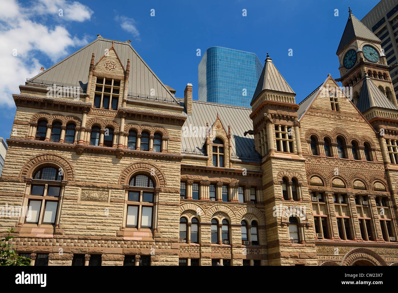 Renovated stonework of the old 1889 Toronto City Hall with high rise buildings Stock Photo