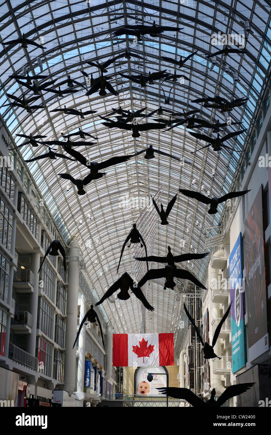 Atrium skylight with Canada Geese art and flag at the Eaton Centre Toronto Stock Photo