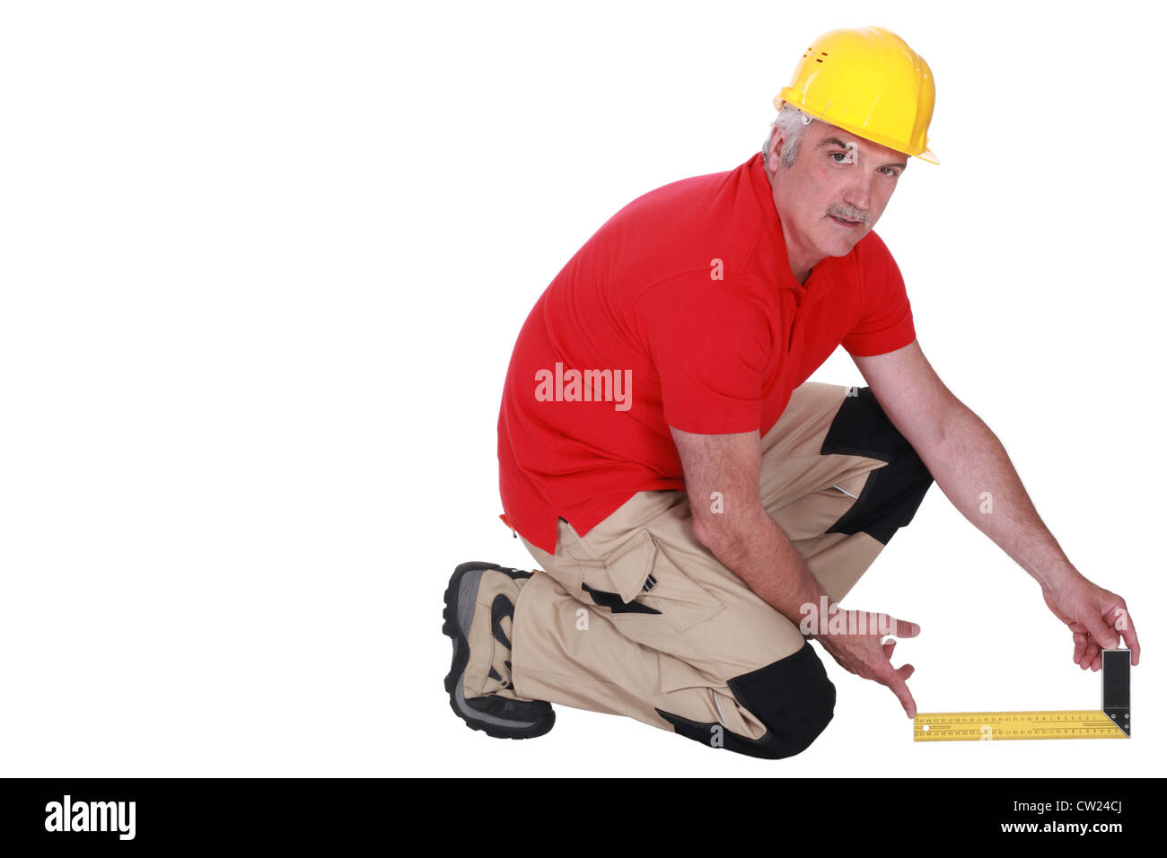 Tradesman holding a try square Stock Photo