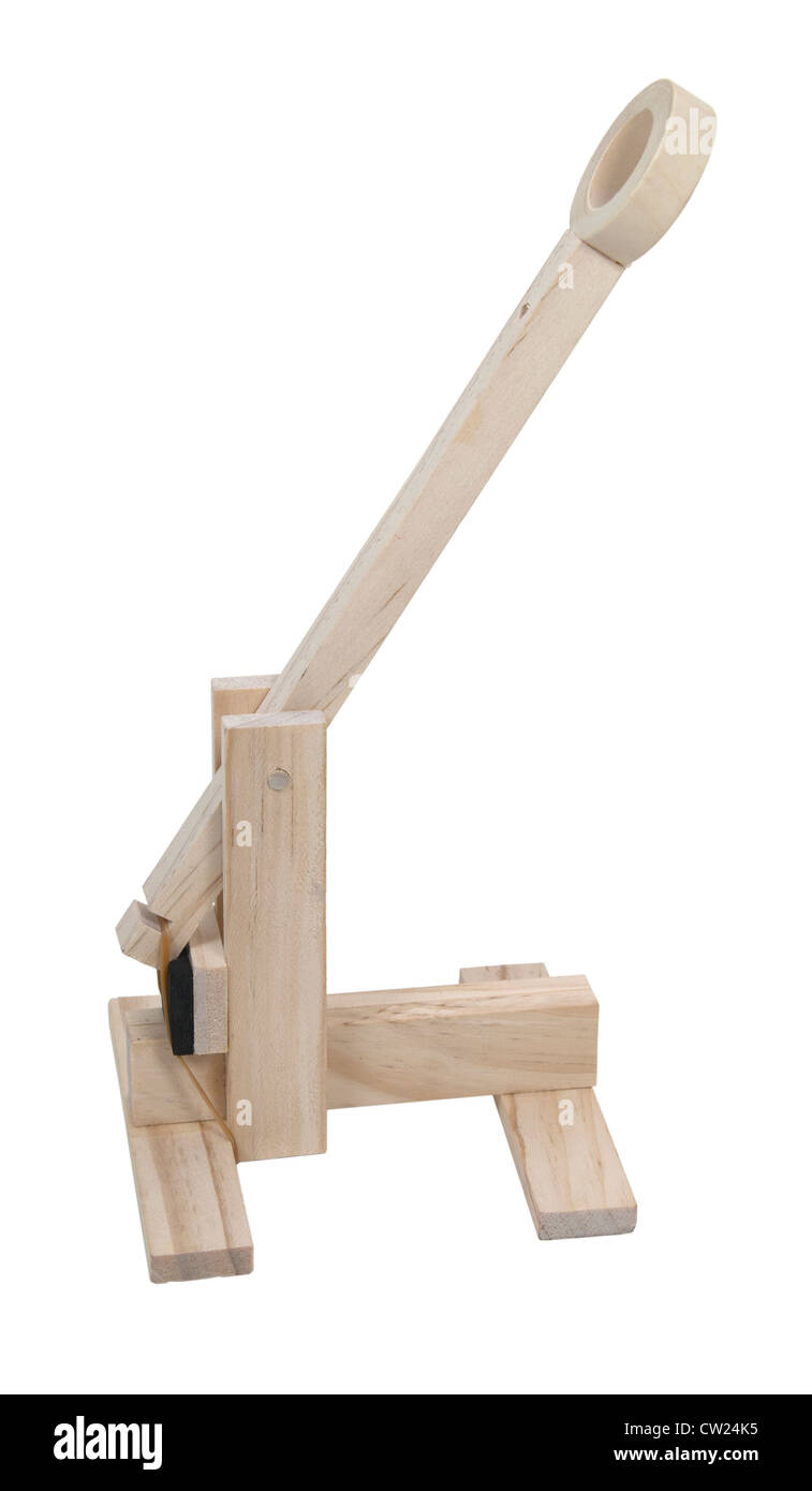 A wooden catapult used to hurdle objects at an opponent - path included Stock Photo