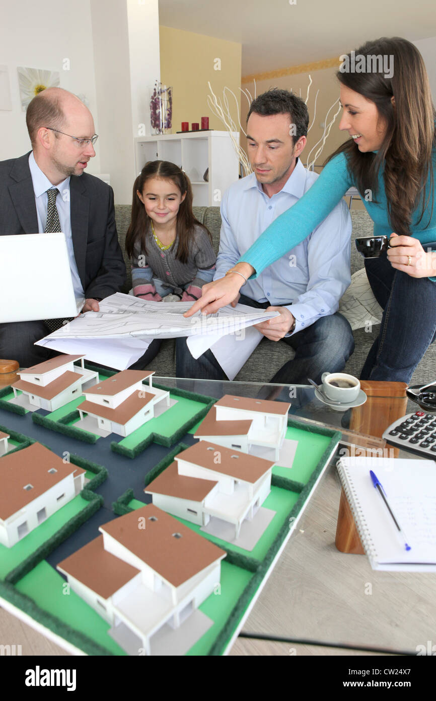 Young family sitting in an architect's office Stock Photo - Alamy