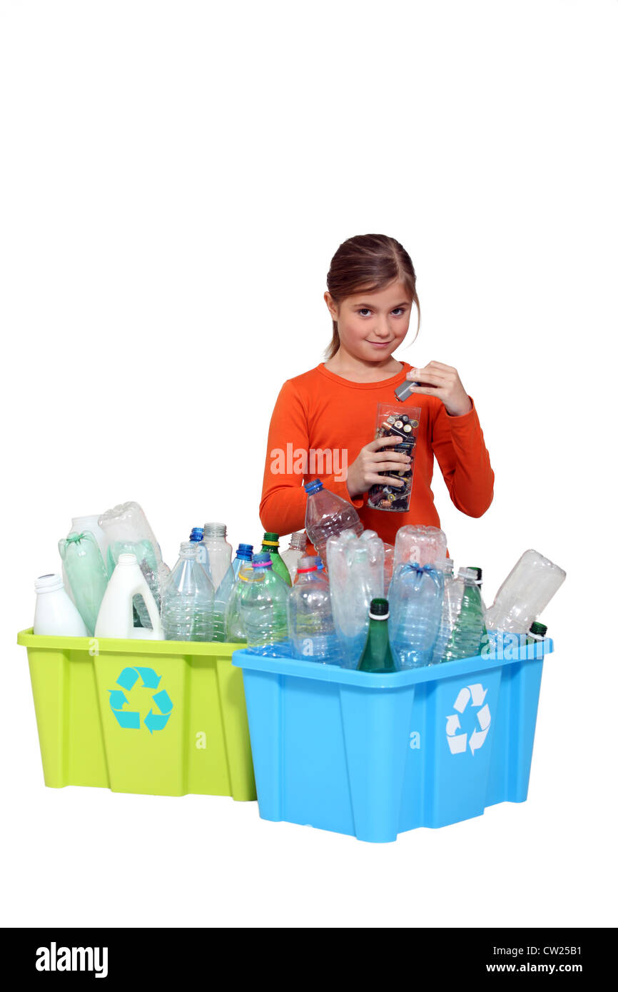 Young girl recycling plastic bottles and batteries Stock Photo Alamy