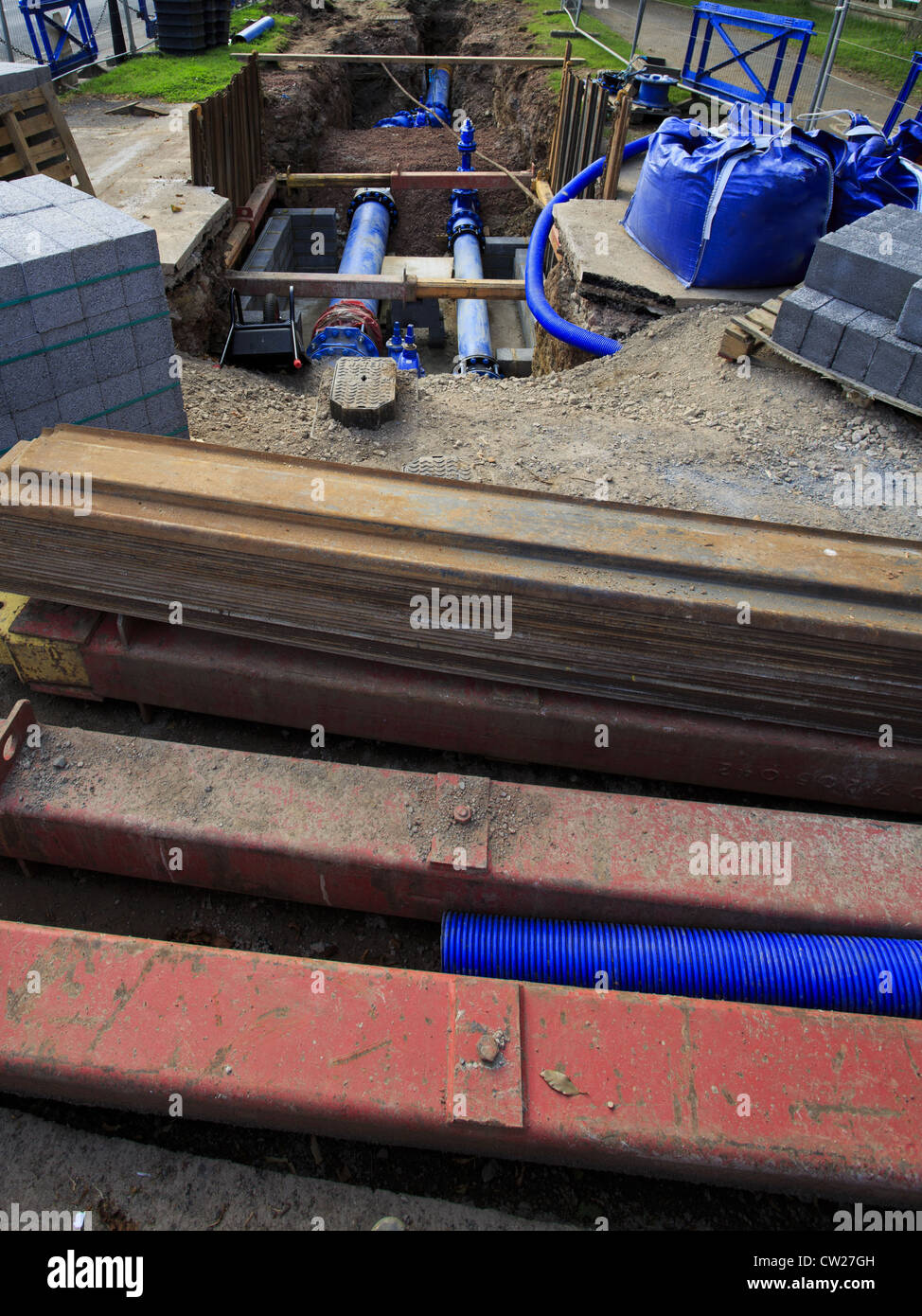 Replacing water main with plastic pipe Stock Photo