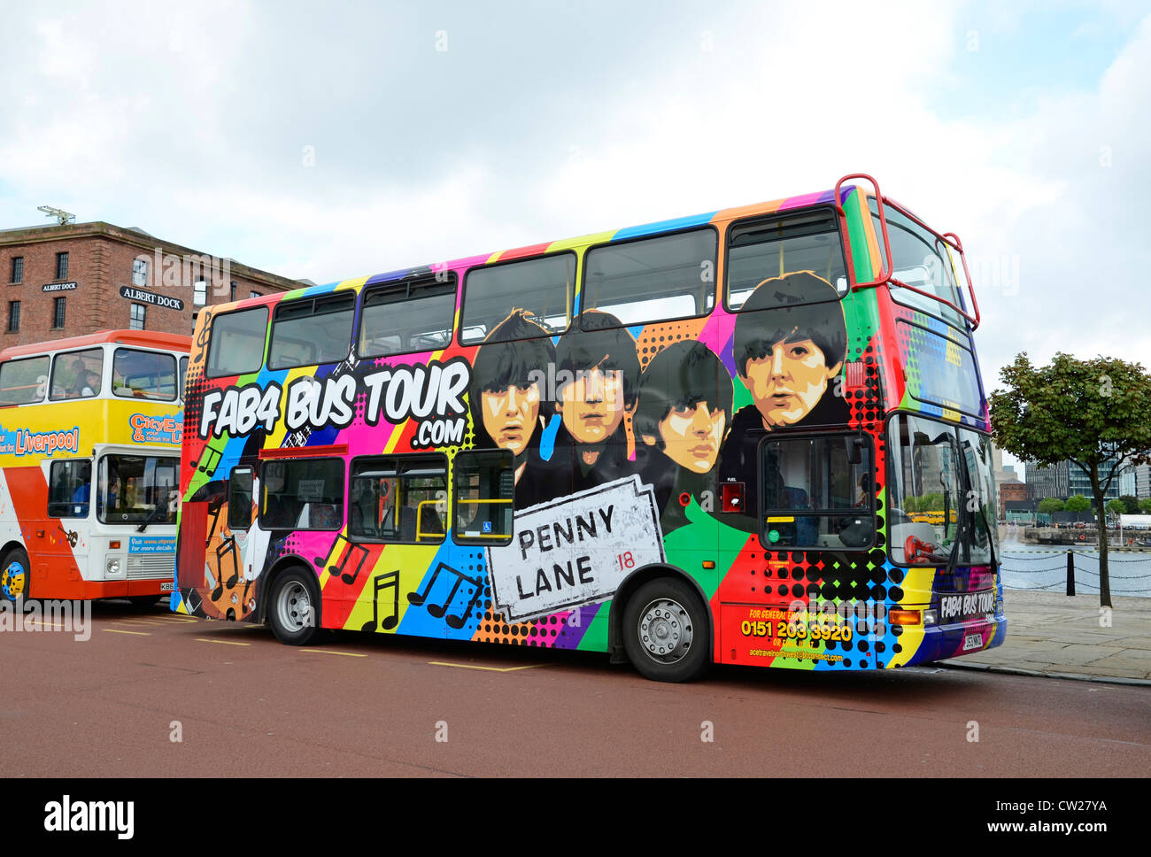The ' Fab 4 ' a Beatles sightseeing tour bus parked at the Albert Dock in Liverpool, Merseyside, UK Stock Photo