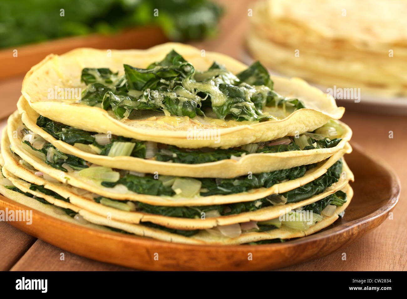 Fresh homemade savory crepes layered with chard (mangold) and onion
