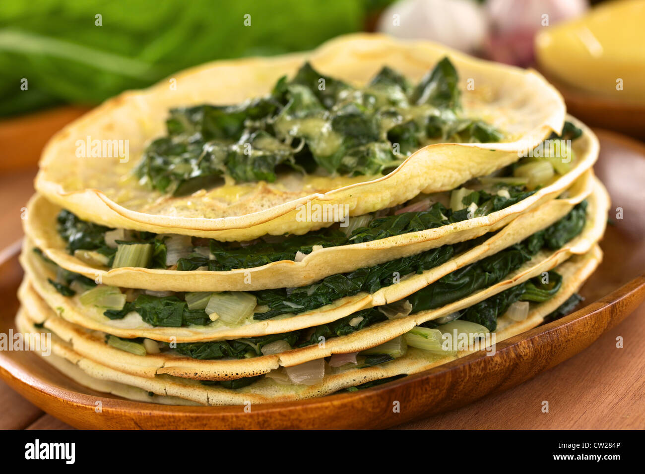 Fresh homemade savory crepes layered with chard (mangold) and onion