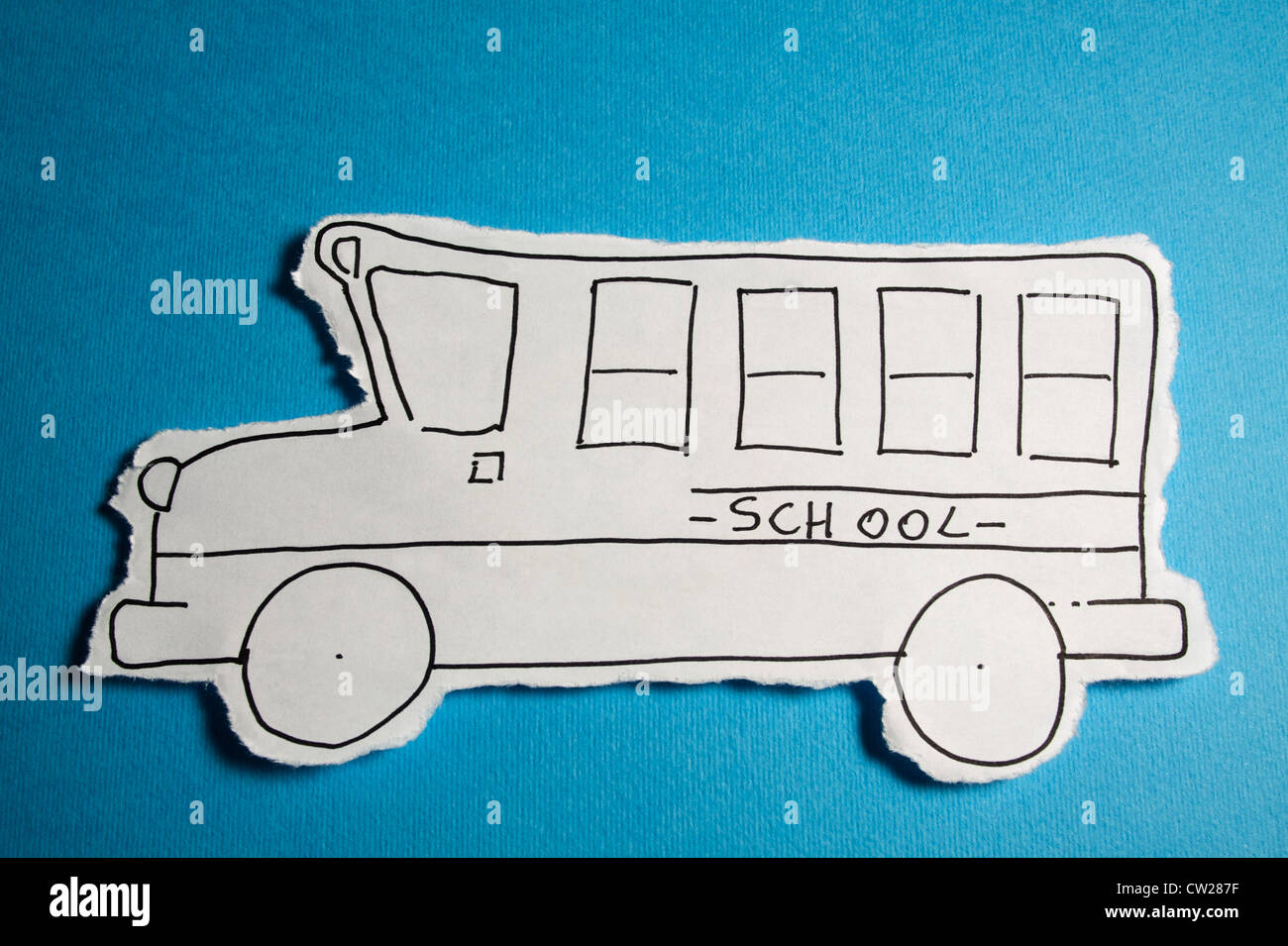 CHILD MADE SKETCH, School bus draw black on white on a Cyan blue background Stock Photo