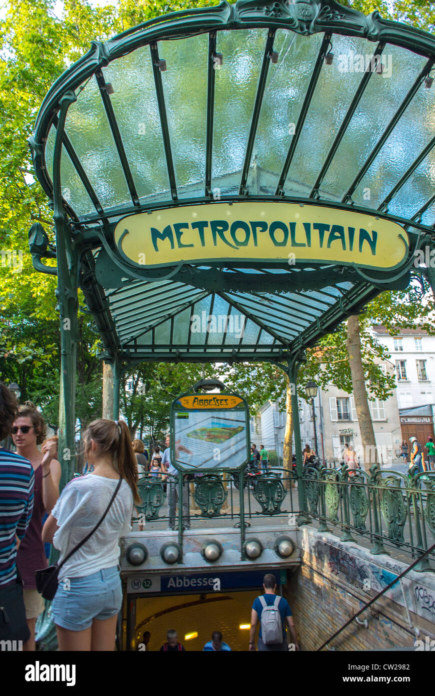 Paris, France, People in Abesses Metro Entrance, Montmartre Area, The canopy is apparently one of only three surviving Art Nouveau canopies designed by Hector Guimard (1867-1942). vintage sign, subway station vintage Stock Photo