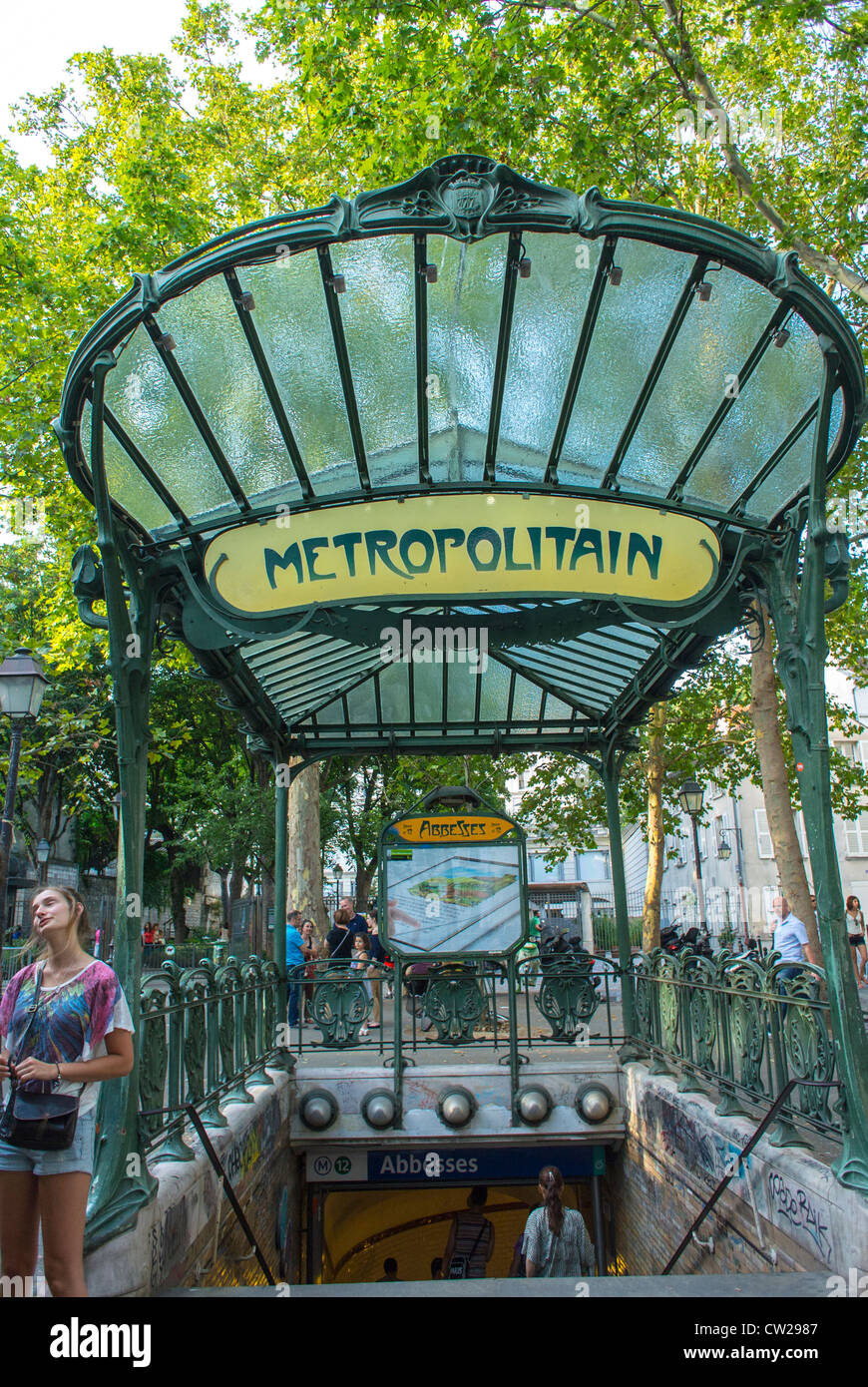 Paris, France, People in Abesses Metro Entrance, Montmartre Area, The canopy is apparently one of only three surviving Art Nouveau canopies designed by Hector Guimard (1867-1942). vintage sign, subway station vintage Stock Photo