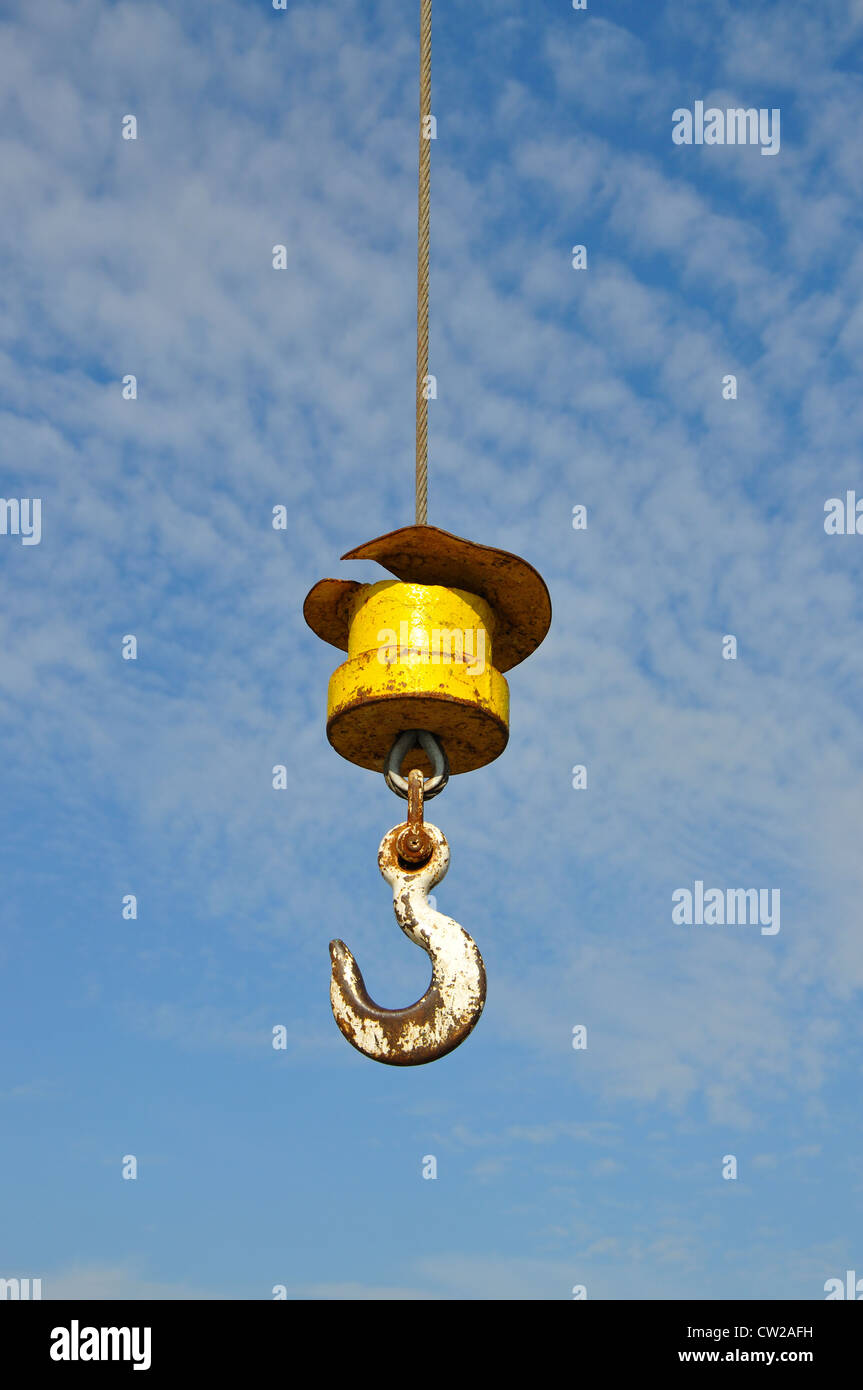 crane hook against blue sky, England, UK Stock Photo