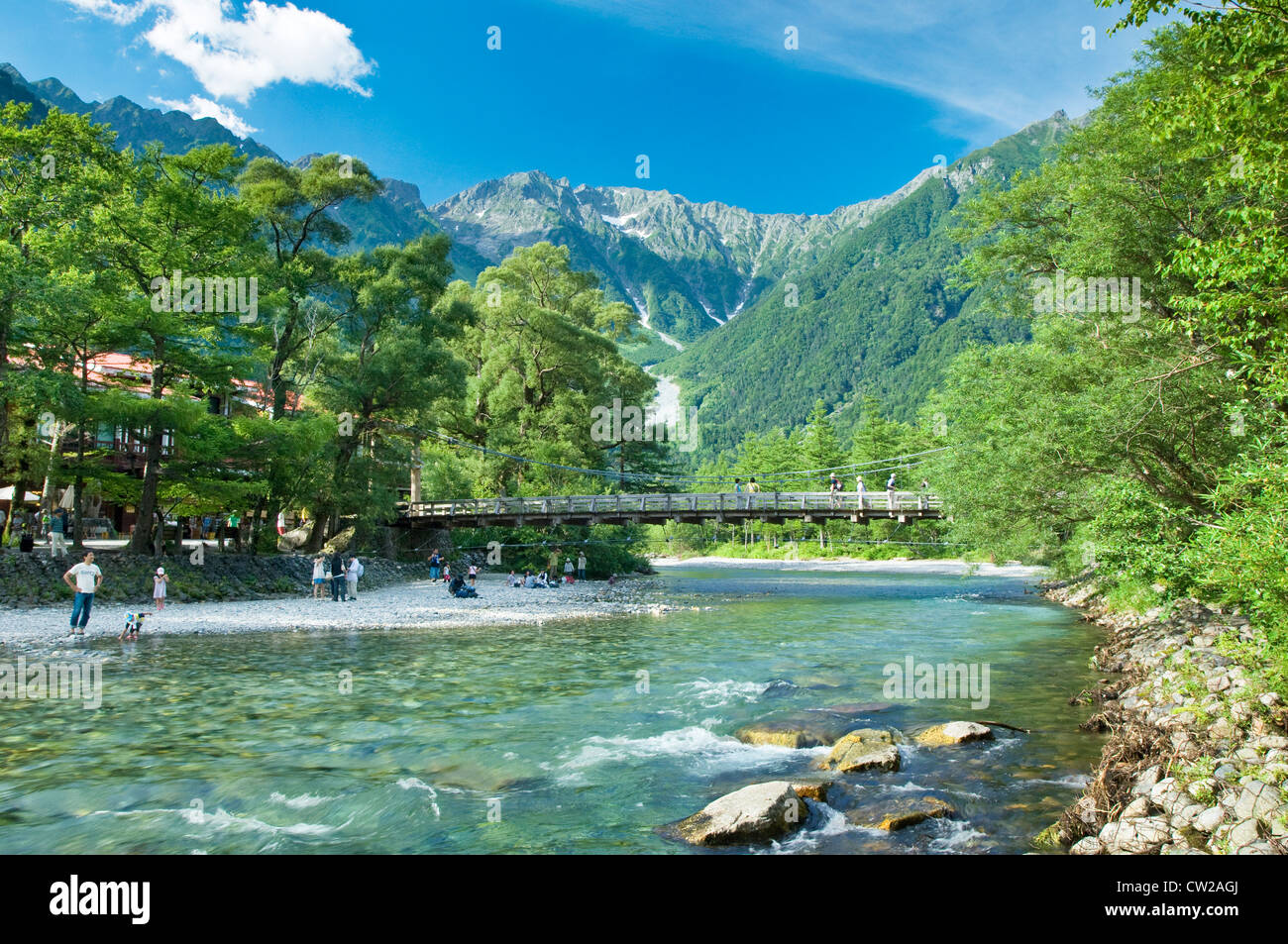 Kappabashi bridge with river and mountains on a sunny day in Kamikochi National Park, Japan Stock Photo