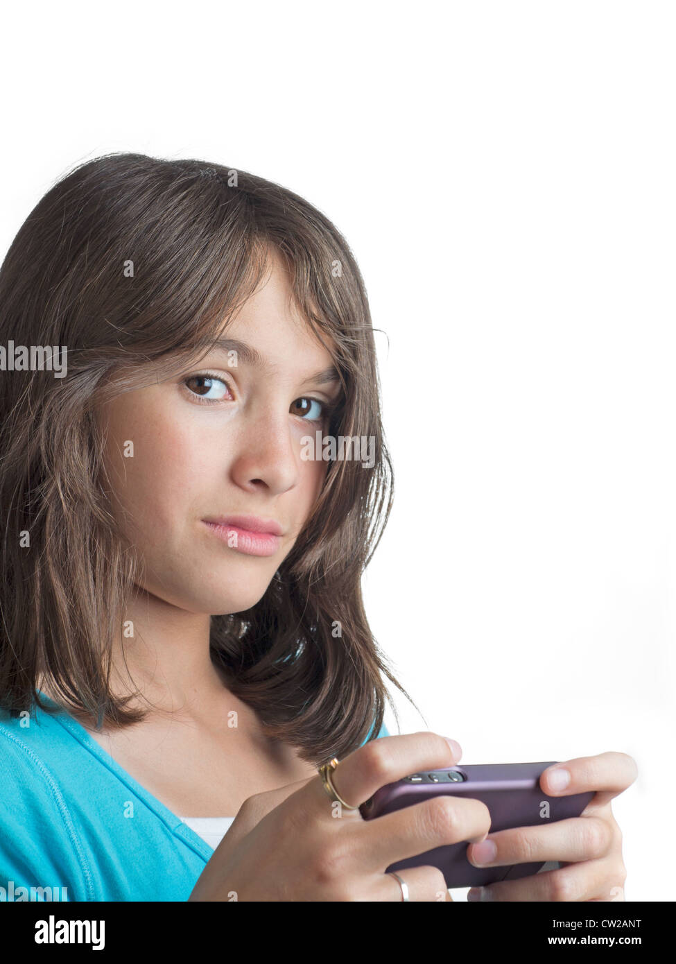 A young girl  in blue top texting isolated on white background Stock Photo