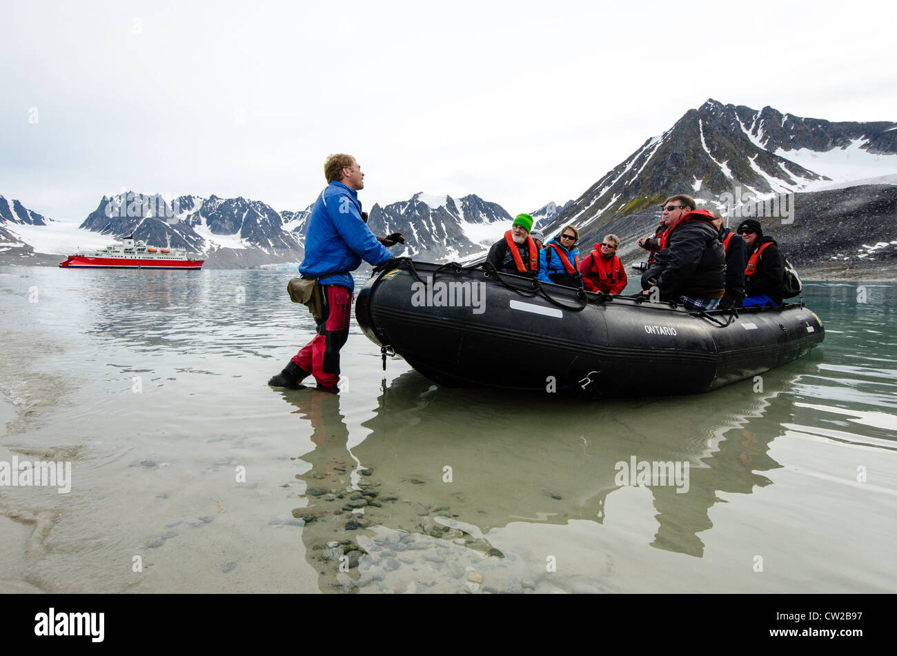 Expedition guide briefing tourists before landing Magdalene Fjord Spitsbergen Svalbard Norway Scandinavia Arctic North Stock Photo