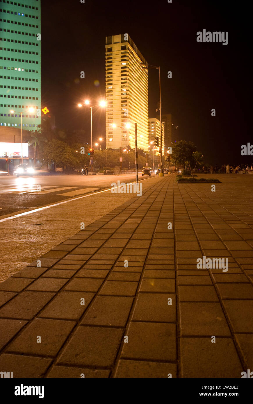 Vast stretch of deserted pavement with Trident Hotel in the Background - Nariman Point, Mumbai, Maharashtra, Stock Photo