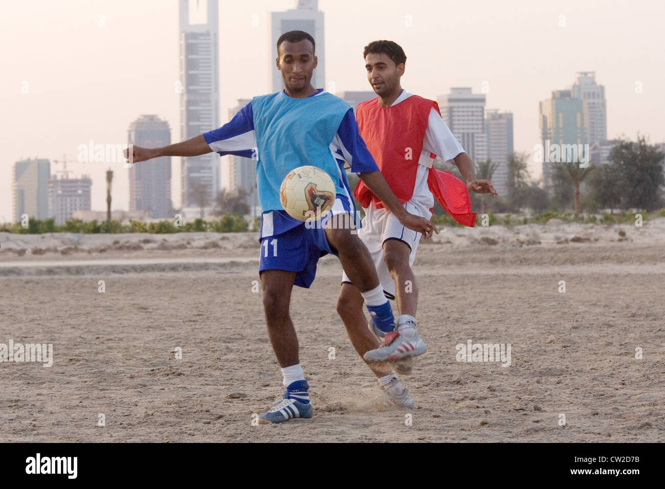 Dubai, men playing football Stock Photo Alamy
