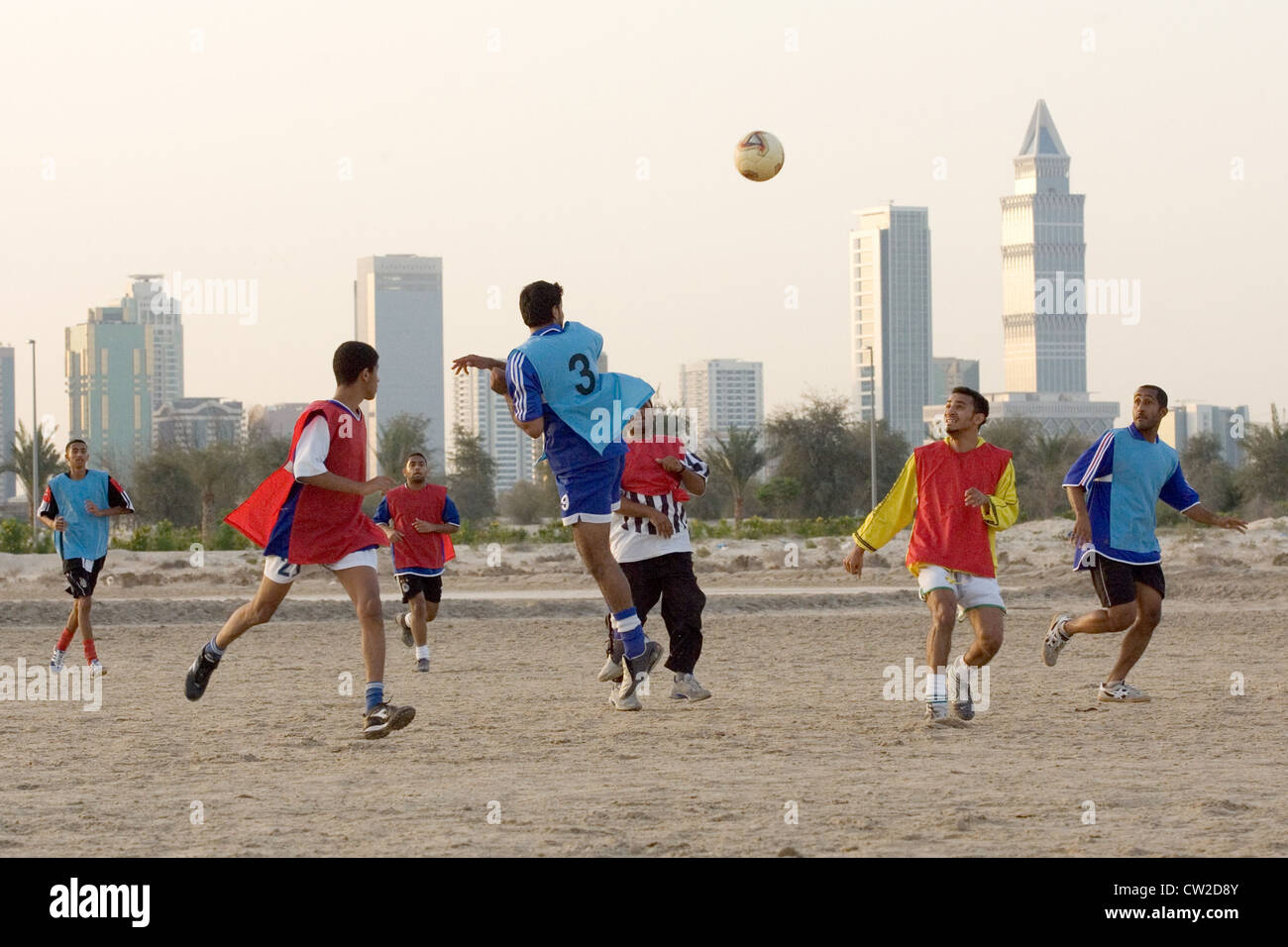 Dubai, men playing football Stock Photo Alamy