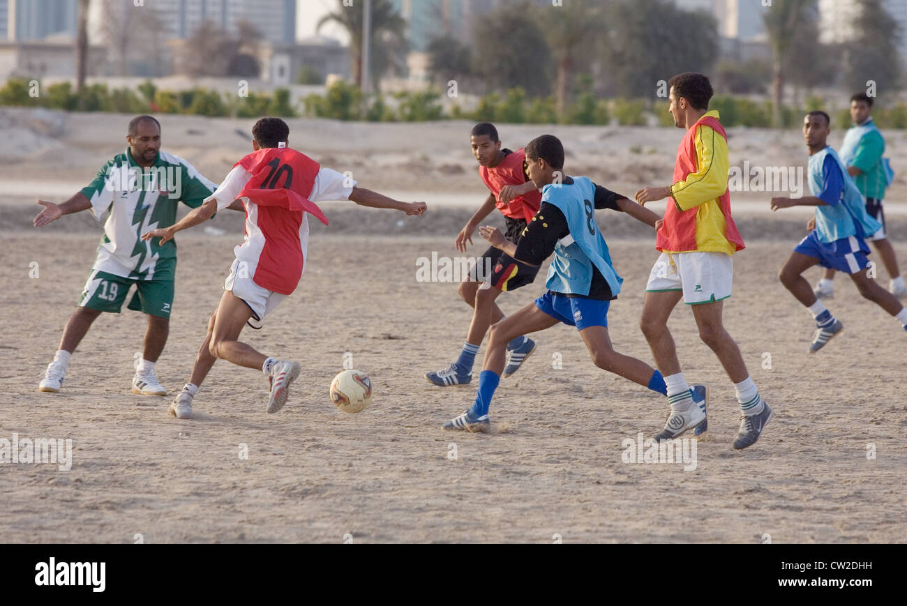 Dubai, men playing football Stock Photo